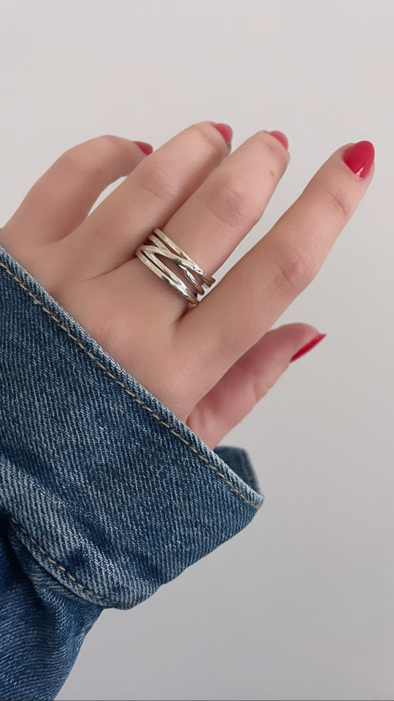 red nails and a denim jacket and the silver orbit ring make a timeless team