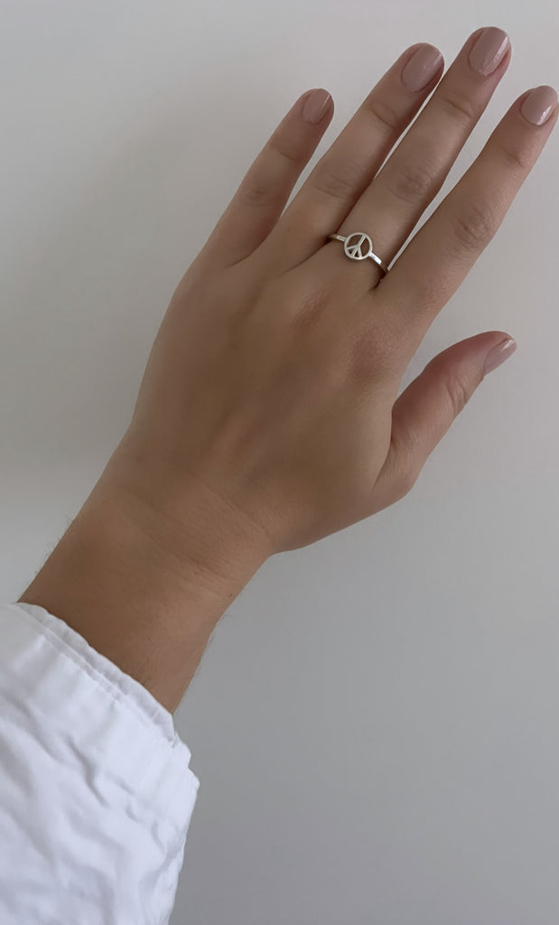 the silver peace sign ring makes a calm statement